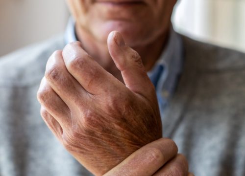 Man rubbing his wrist