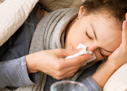 Woman sick with the common cold