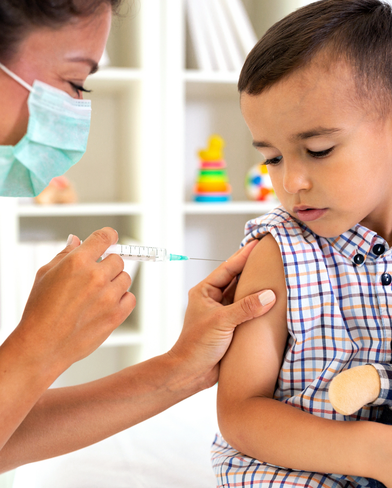 A little boy receiving an injection