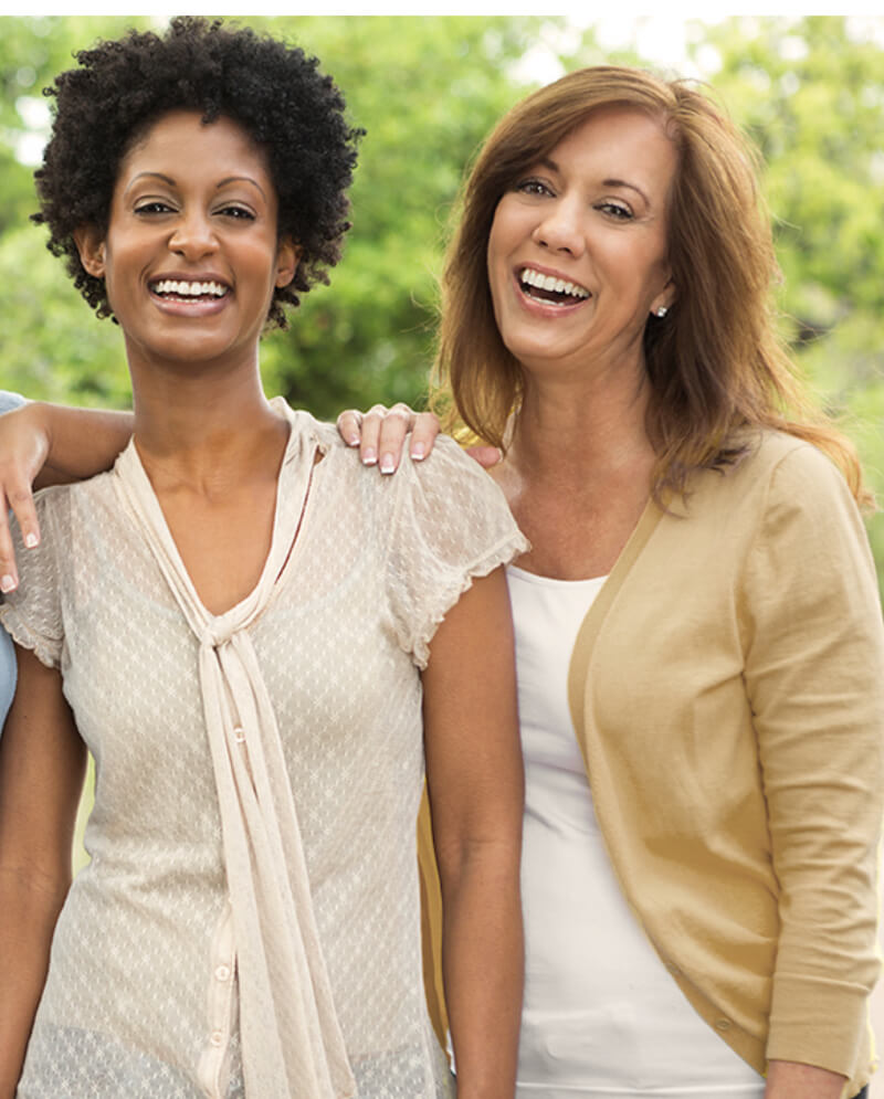 Two women laughing together