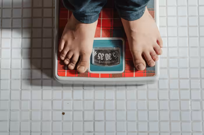 two feet on a weighing scale