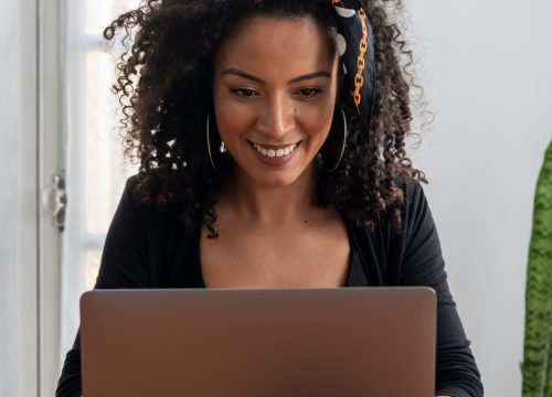 Woman using telehealth services on her laptop