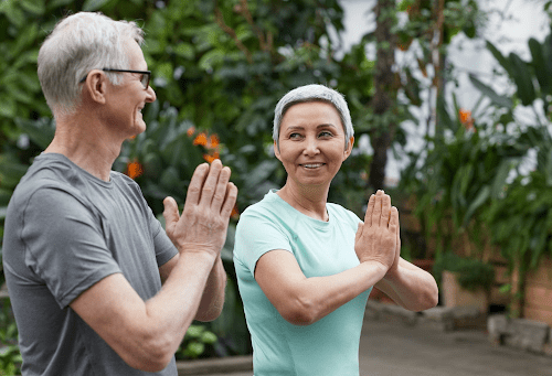 Older couple doing yoga